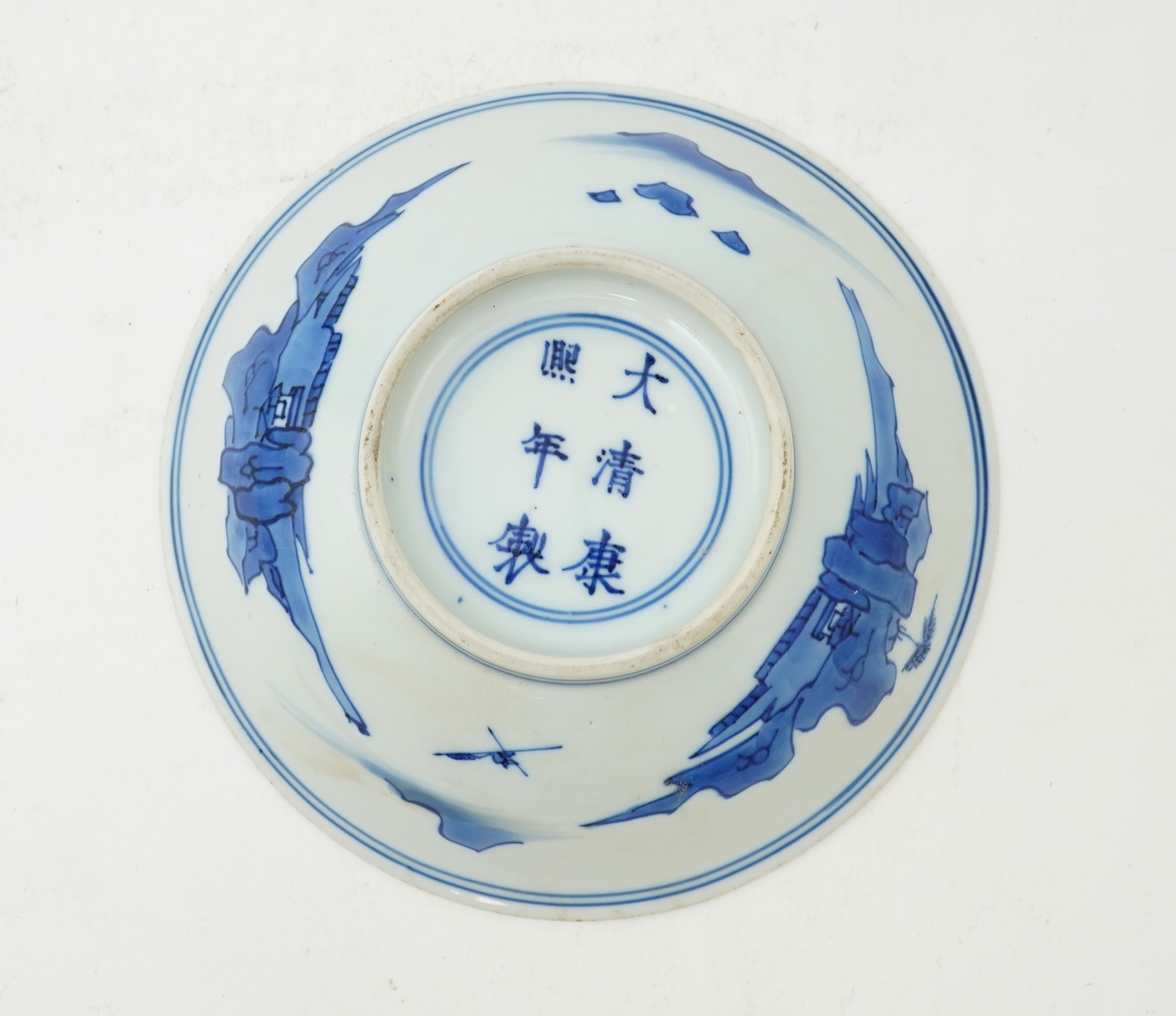 A Chinese blue and white saucer dish, Kangxi six character mark and of the period (1662-1722)